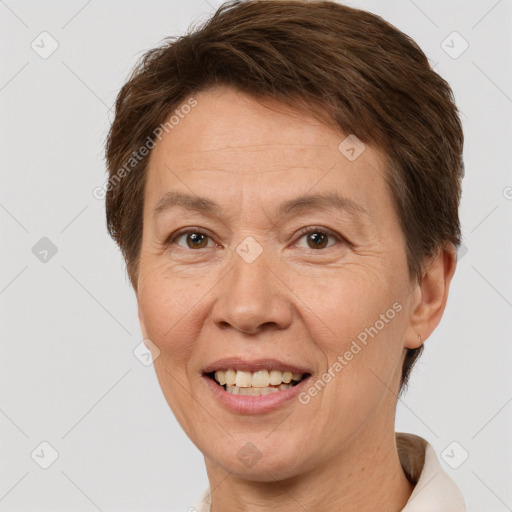 Joyful white adult female with short  brown hair and brown eyes