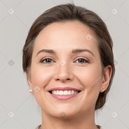 Joyful white young-adult female with medium  brown hair and grey eyes