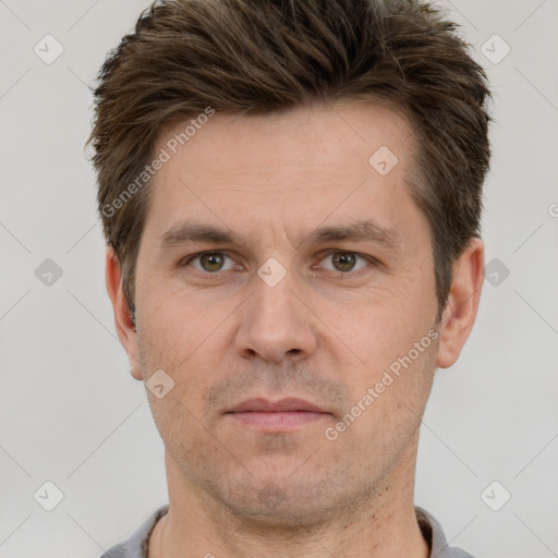 Joyful white adult male with short  brown hair and grey eyes