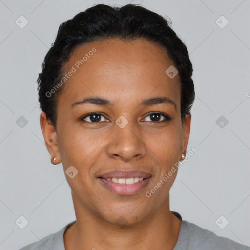 Joyful black young-adult female with short  black hair and brown eyes