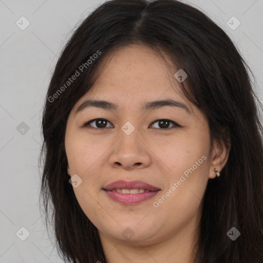 Joyful asian young-adult female with long  brown hair and brown eyes