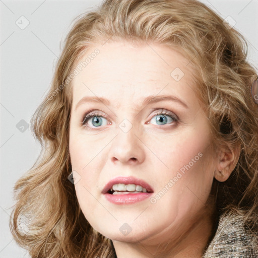 Joyful white young-adult female with medium  brown hair and blue eyes