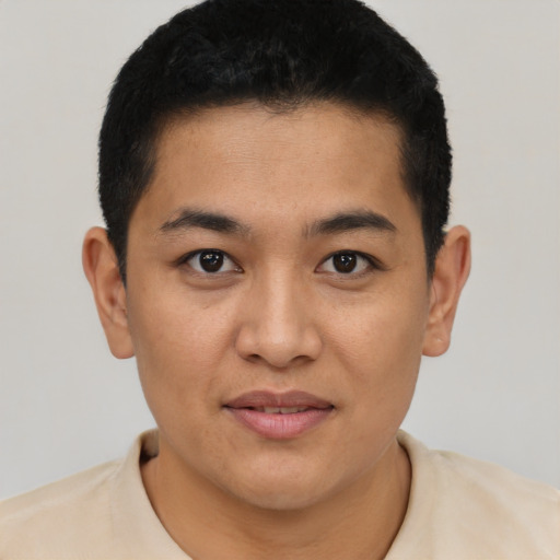 Joyful asian young-adult male with short  black hair and brown eyes