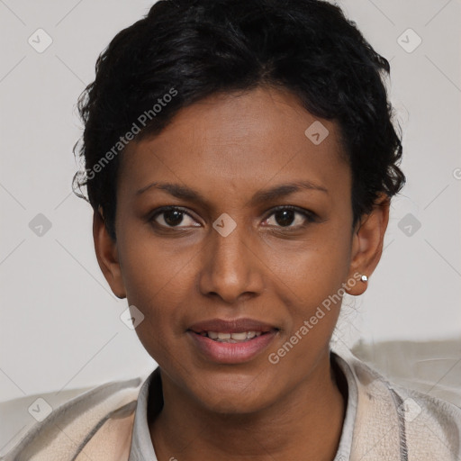 Joyful black young-adult female with short  black hair and brown eyes