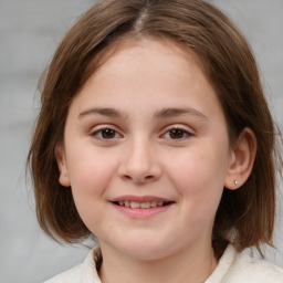 Joyful white child female with medium  brown hair and brown eyes