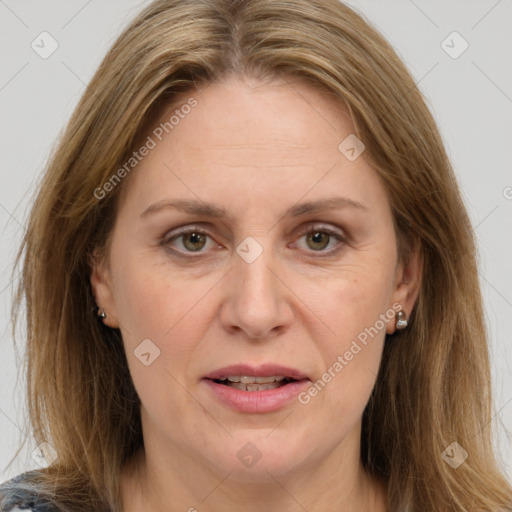 Joyful white adult female with medium  brown hair and brown eyes