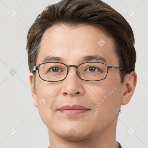 Joyful white adult male with short  brown hair and brown eyes