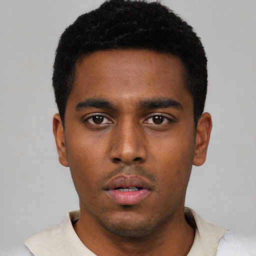 Neutral black young-adult male with short  black hair and brown eyes
