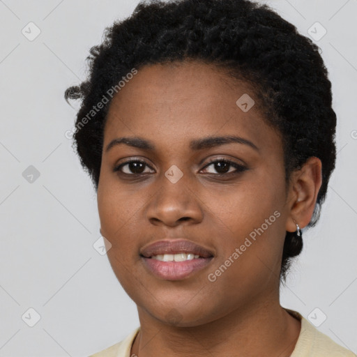 Joyful black young-adult female with short  black hair and brown eyes