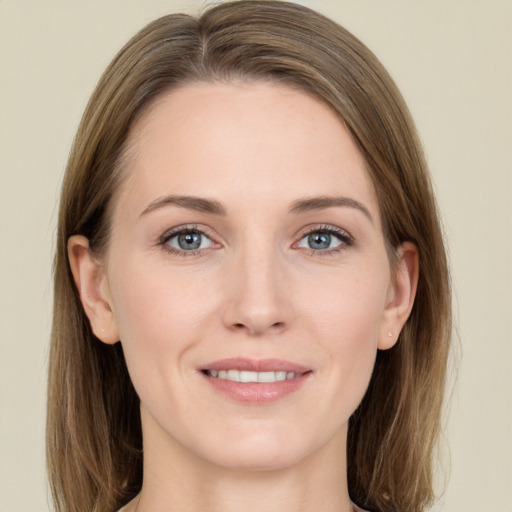 Joyful white young-adult female with long  brown hair and grey eyes