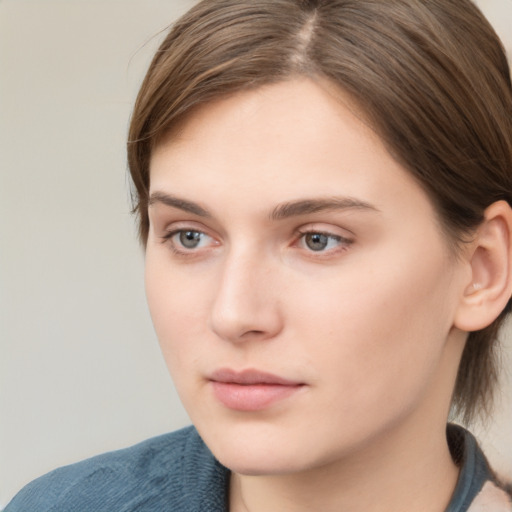 Neutral white young-adult female with medium  brown hair and grey eyes