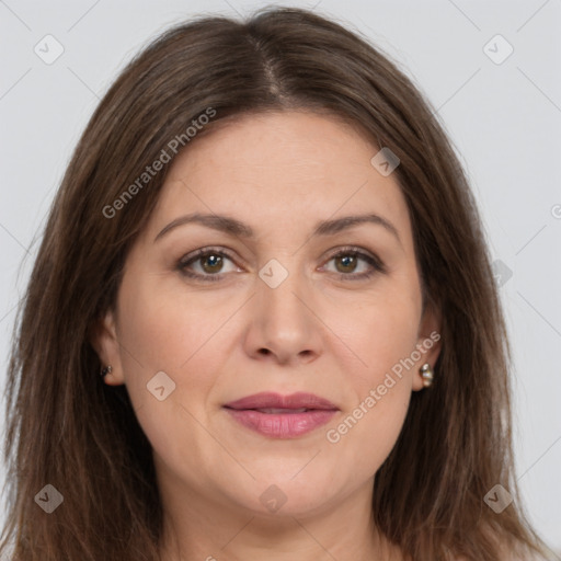 Joyful white adult female with long  brown hair and brown eyes