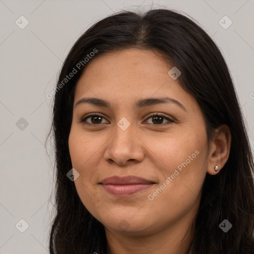 Joyful latino young-adult female with long  brown hair and brown eyes