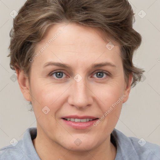 Joyful white adult female with short  brown hair and grey eyes