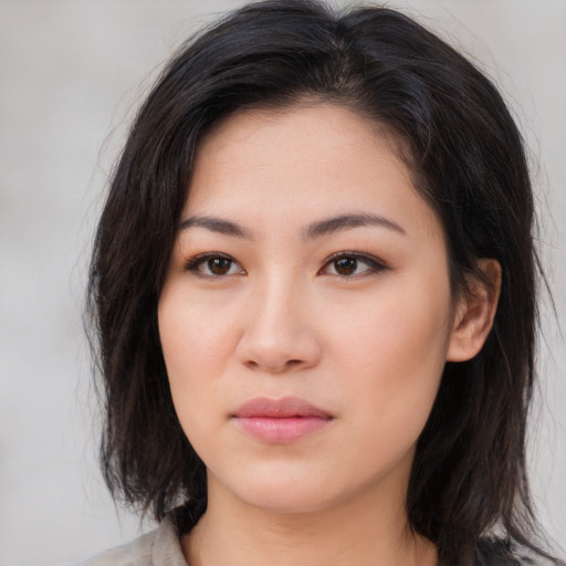 Neutral asian young-adult female with medium  brown hair and brown eyes
