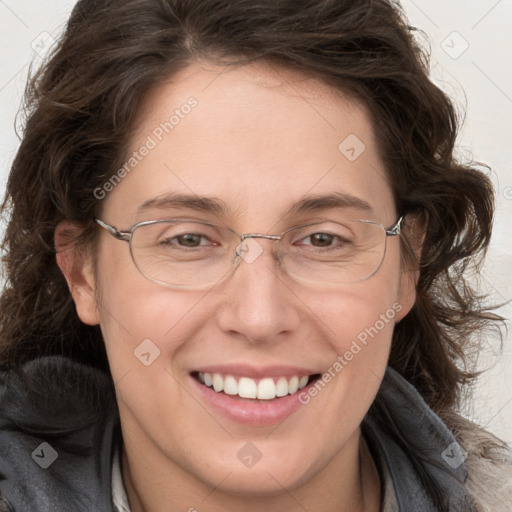 Joyful white adult female with long  brown hair and grey eyes