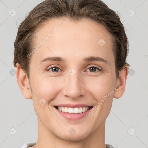 Joyful white young-adult female with short  brown hair and grey eyes