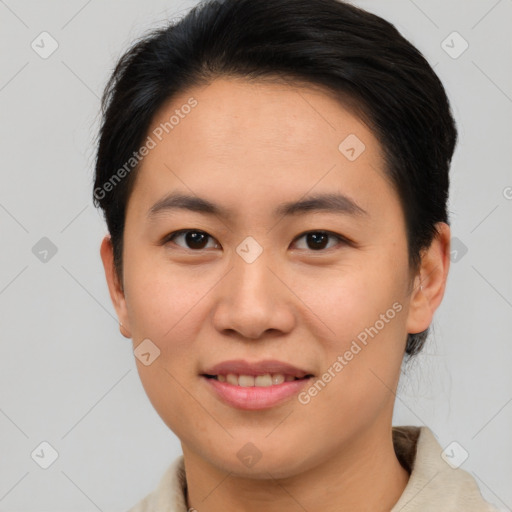 Joyful asian young-adult female with short  brown hair and brown eyes