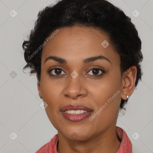 Joyful black young-adult female with short  brown hair and brown eyes