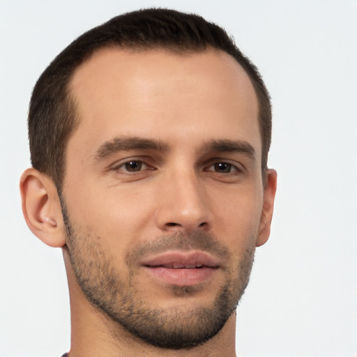 Joyful white young-adult male with short  brown hair and brown eyes