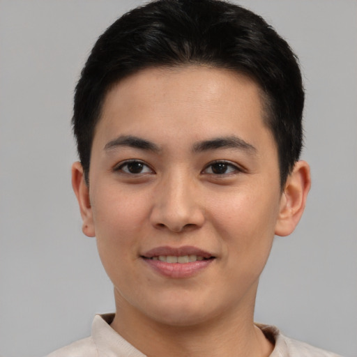 Joyful asian young-adult male with short  brown hair and brown eyes