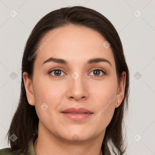 Joyful white young-adult female with long  brown hair and grey eyes