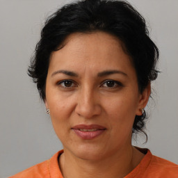 Joyful white adult female with medium  brown hair and brown eyes