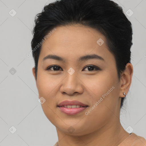 Joyful asian young-adult female with short  brown hair and brown eyes