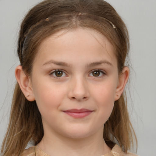 Joyful white child female with medium  brown hair and brown eyes