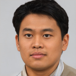 Neutral asian young-adult male with short  brown hair and brown eyes