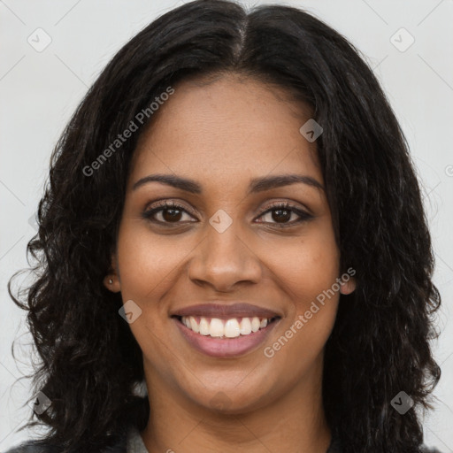 Joyful black young-adult female with long  black hair and brown eyes