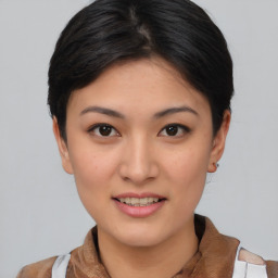 Joyful asian young-adult female with short  brown hair and brown eyes