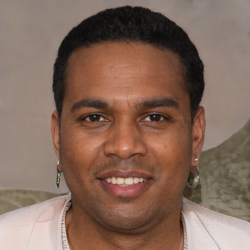 Joyful black young-adult male with short  black hair and brown eyes