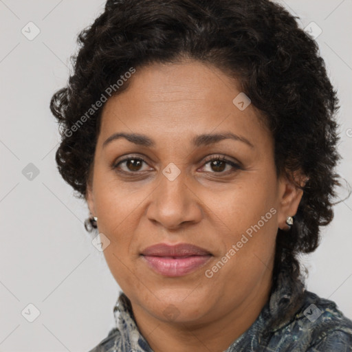 Joyful latino adult female with medium  brown hair and brown eyes