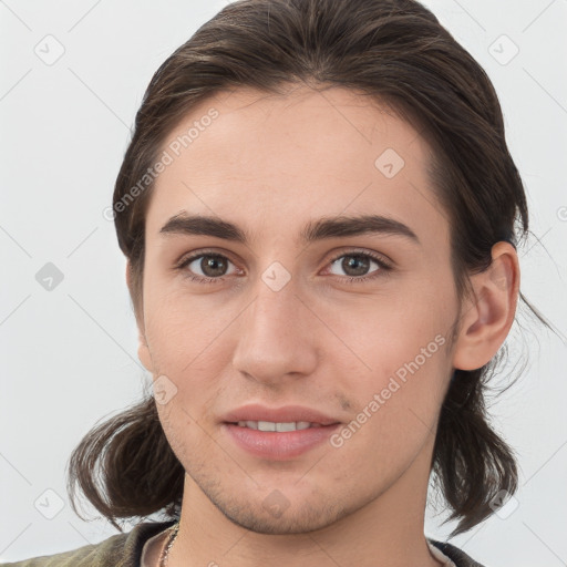 Joyful white young-adult female with medium  brown hair and brown eyes