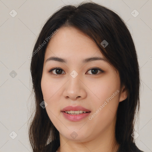 Joyful asian young-adult female with long  brown hair and brown eyes