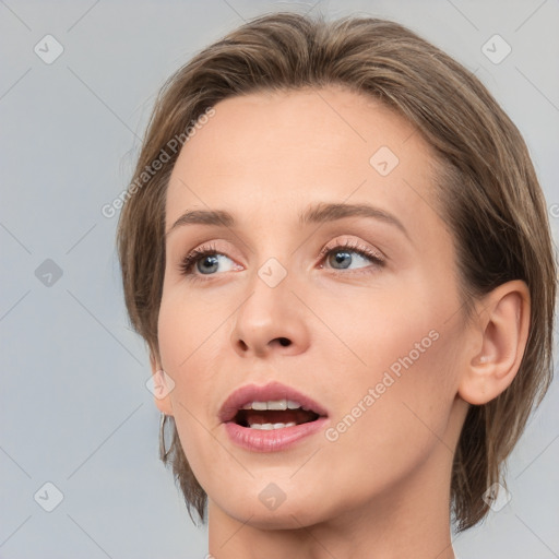 Joyful white young-adult female with medium  brown hair and blue eyes