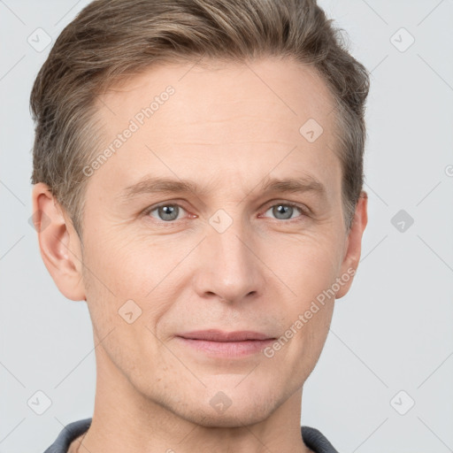 Joyful white adult male with short  brown hair and grey eyes