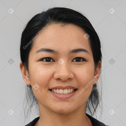 Joyful asian young-adult female with medium  black hair and brown eyes