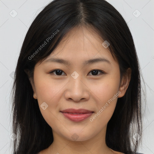 Joyful asian young-adult female with long  brown hair and brown eyes