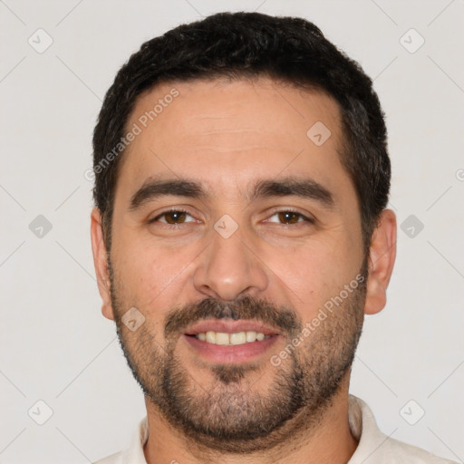 Joyful white young-adult male with short  black hair and brown eyes