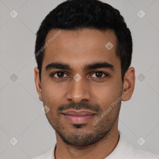 Joyful latino young-adult male with short  black hair and brown eyes