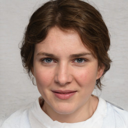 Joyful white young-adult female with medium  brown hair and blue eyes