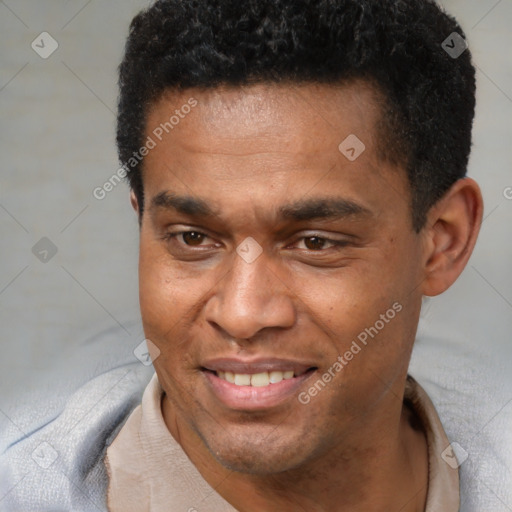 Joyful black adult male with short  black hair and brown eyes