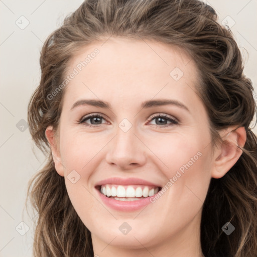 Joyful white young-adult female with long  brown hair and green eyes