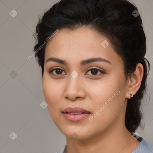 Joyful latino young-adult female with medium  brown hair and brown eyes