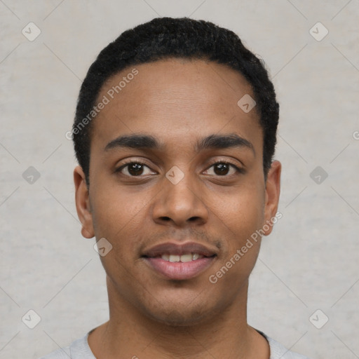 Joyful latino young-adult male with short  black hair and brown eyes