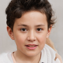 Joyful white child male with short  brown hair and brown eyes