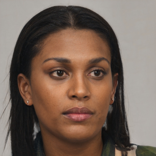 Neutral black young-adult female with long  brown hair and brown eyes