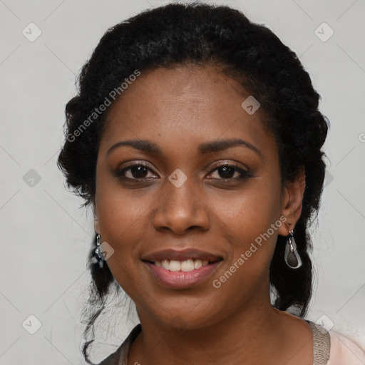 Joyful black young-adult female with long  black hair and brown eyes